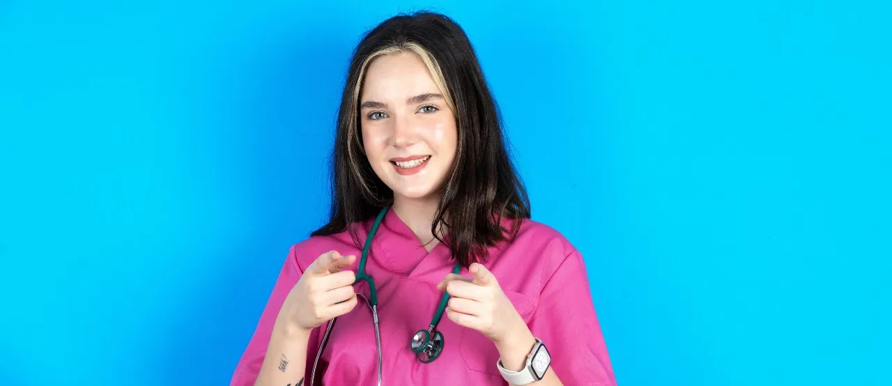 Happy nurse doing the finger pointing